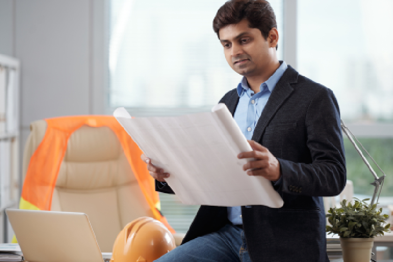 Hotel development consultant presenting a detailed feasibility report for hotel project to financial partners.