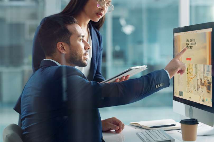 A hotel manager using an AI dashboard for human-centric AI leadership and team scheduling.